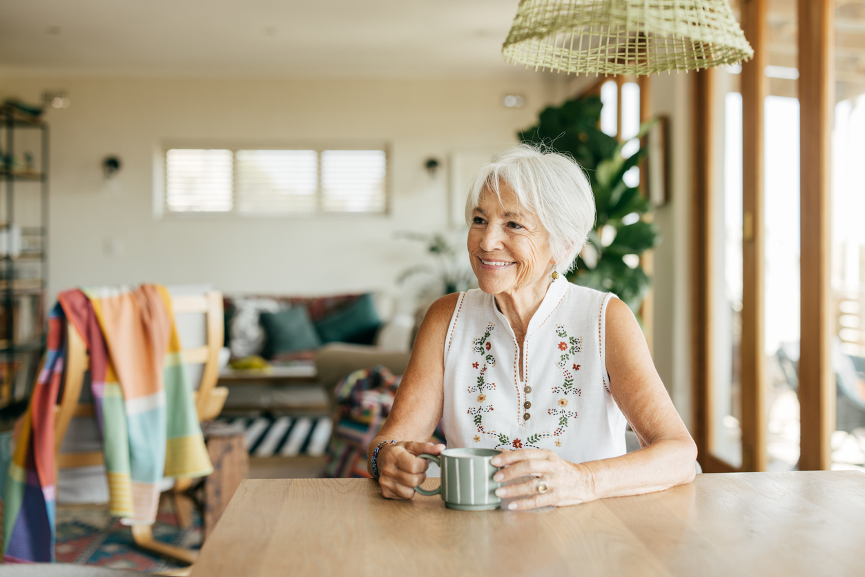 independent living adult sitting in kitchen
